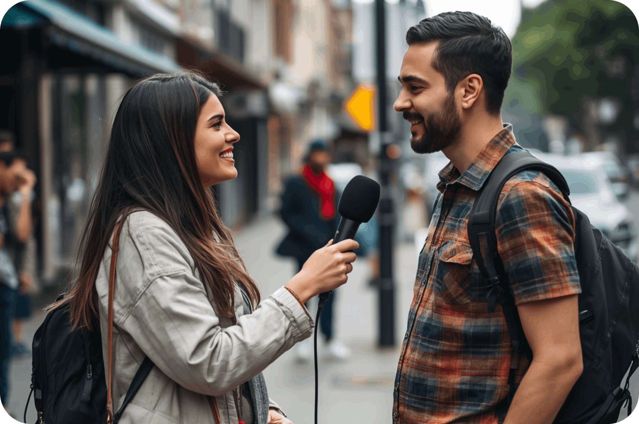 A woman interviewing a man in the streets